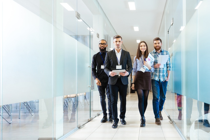 business people walking down the hall to work somewhere else